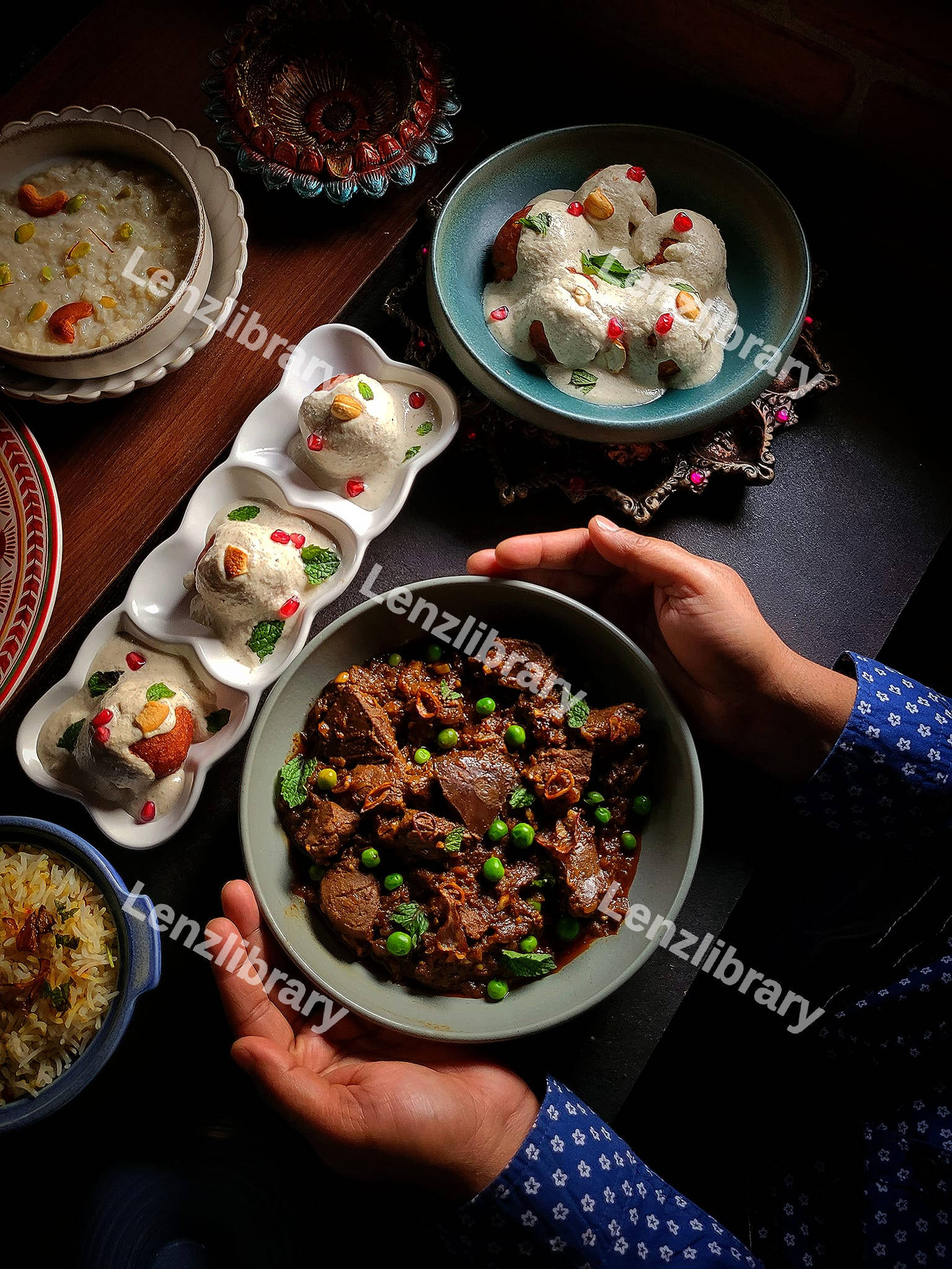 A person holding a bowl with beef stew